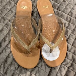 Ugg Alarria II metallic gold flip flops , size 6.